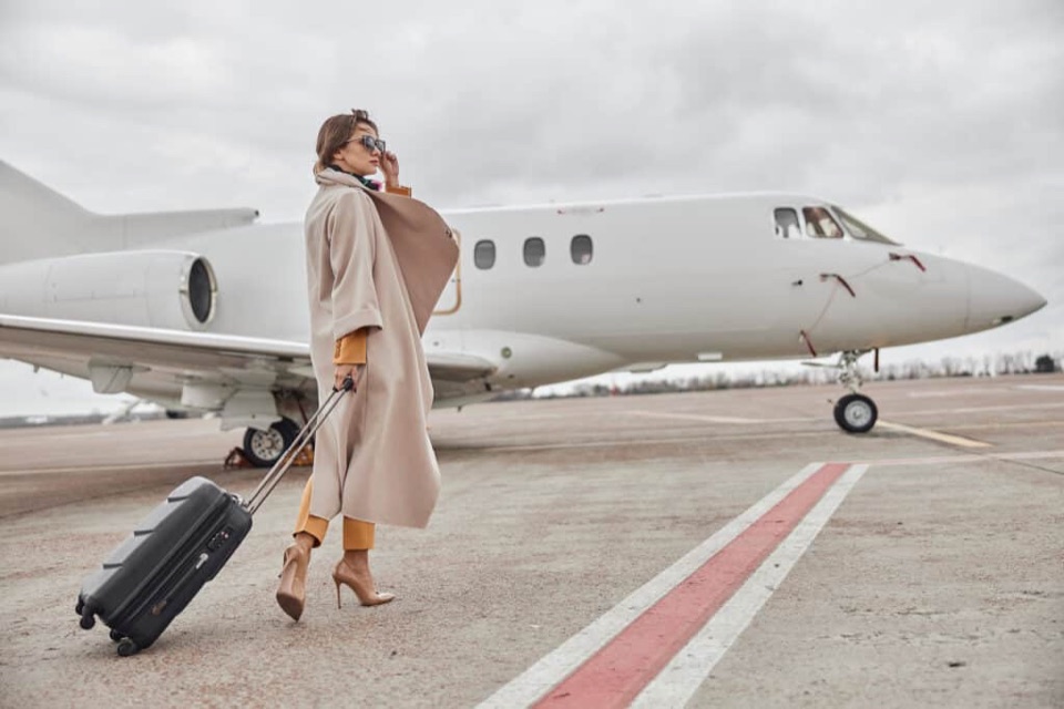 Traveler walking to a private jet on the ramp